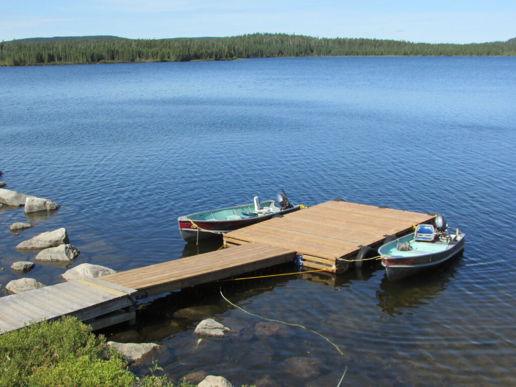 A photo of the dock and boats at Duffy Camp.